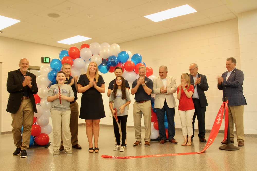 Guilford Elementary students celebrate cutting the ribbon to open the school