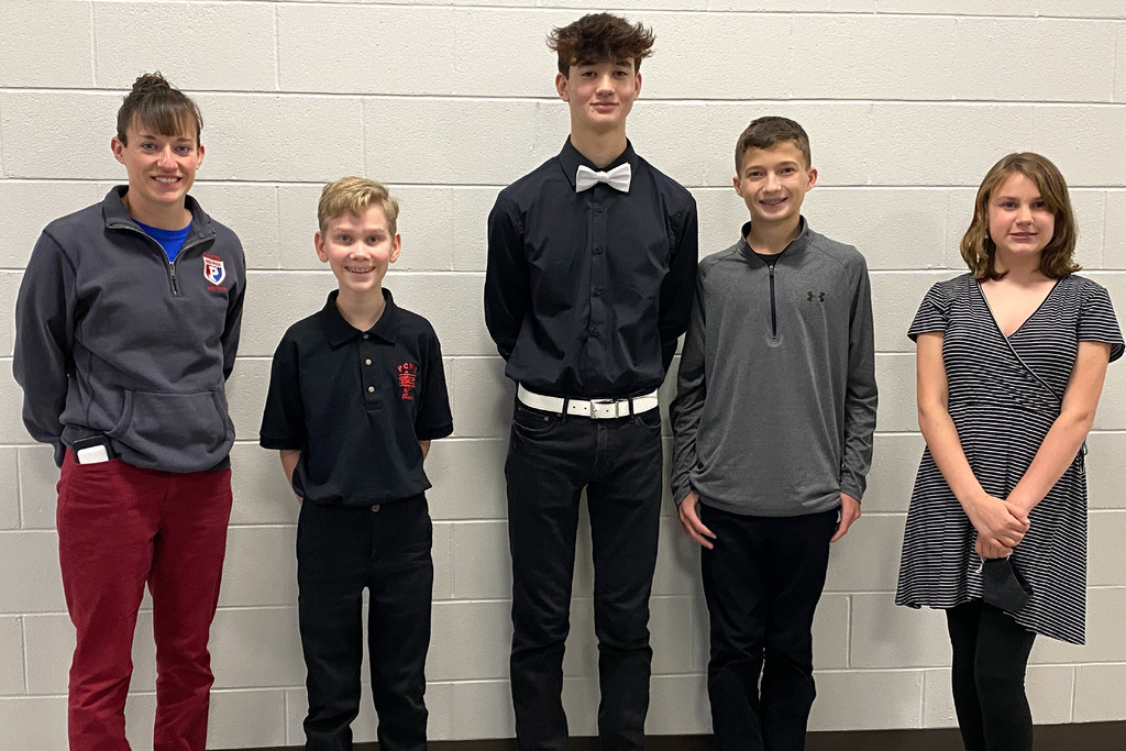 PCMS Band Director Erika Stepp, with All-Region Honor Band students from PCMS: Anthony Meek (Baritone), Jackson Nebergall (Percussion,), Isaiah Gray (Trumpet), and Abigail Langford (French Horn)