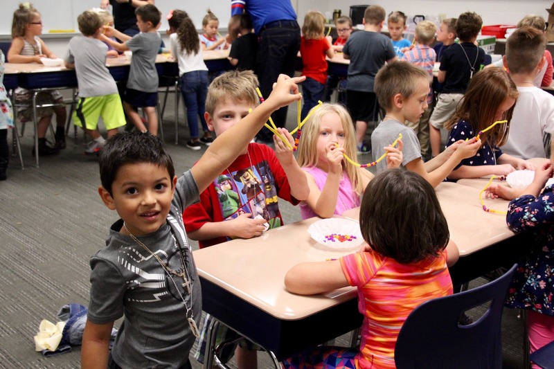 Using colored beads and pipe cleaners, students learned how patterns can equate to coding.