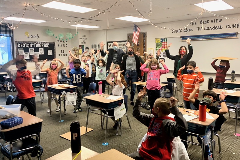 Mrs. Thacker and Mr. Olinger, along with her students, help Ms. Carmichael celebrate being named the 2022 Central Teacher of the Year.