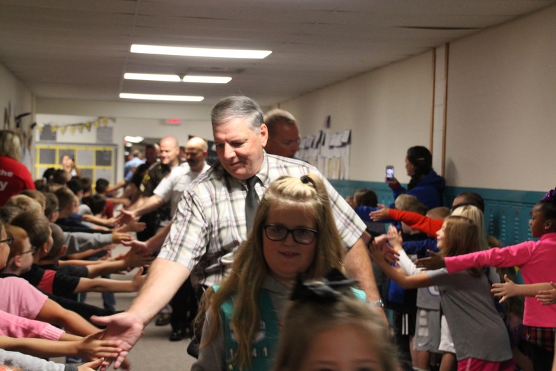 Plainfield Police Chief, Mr. Krieger, was all smiles as he high five-d the students at Van Buren