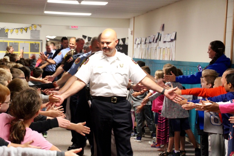 Plainfield Fire Territory Chief, Mr. Thacker, greeting students as he and his colleagues were honored on Patriot Day