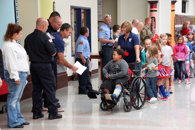 Clarks Creek students present members of the military with cards and letters on Patriot Day