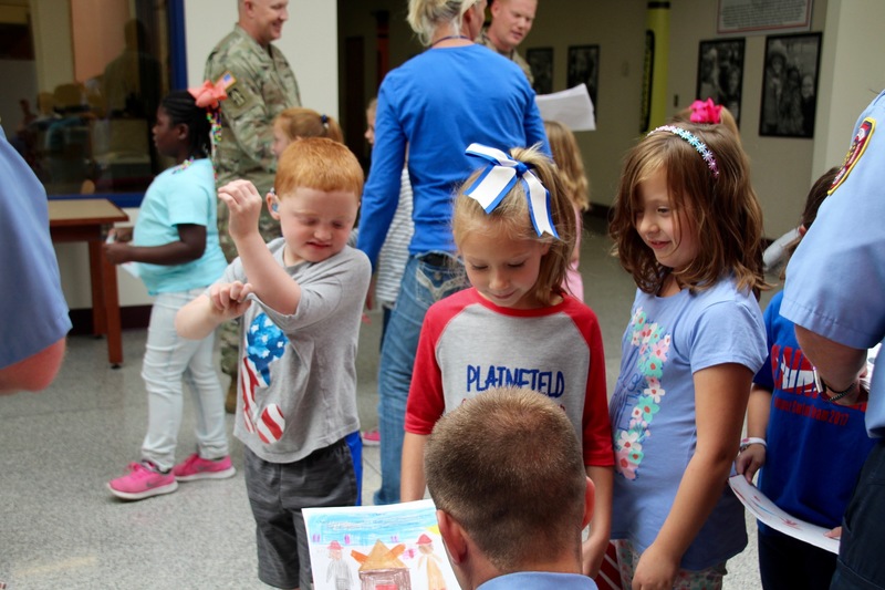 Clarks Creek students present members of the military with cards and letters on Patriot Day