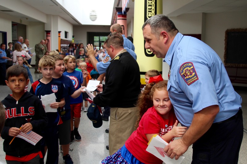 Clarks Creek students present members of the military with cards and letters on Patriot Day