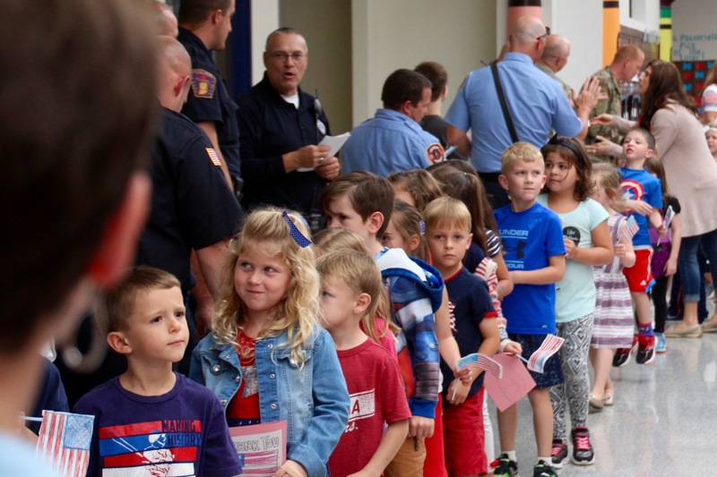 Clarks Creek students present members of the military with cards and letters on Patriot Day