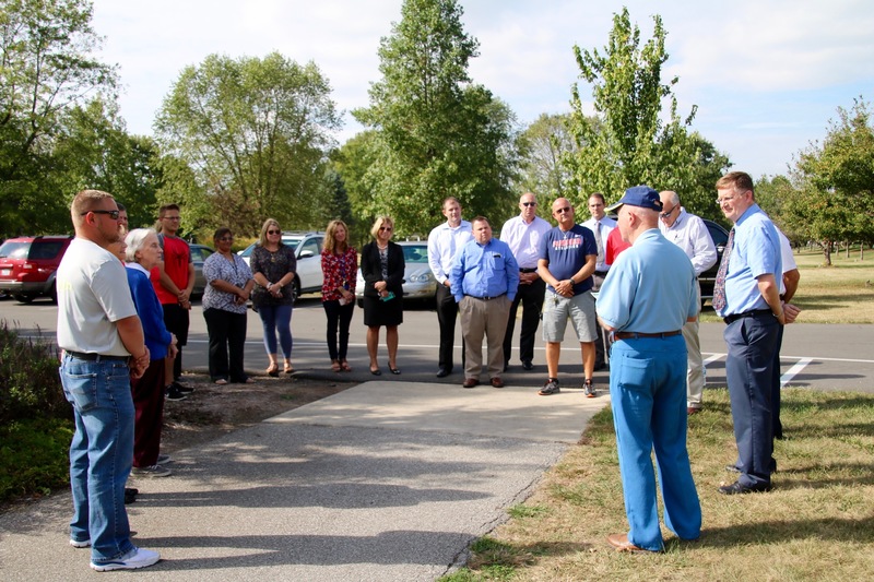 Town and school officials gather with members of the Plainfield Rotary and Teacher of the Year, Brad DeHoff.