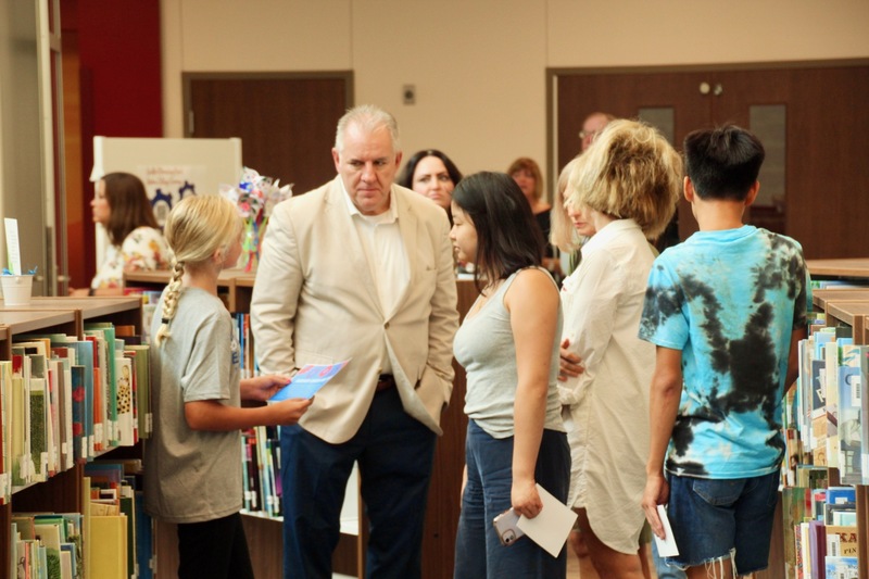 Ambassadors talk with guests at the Guilford Elementary School ribbon-cutting event