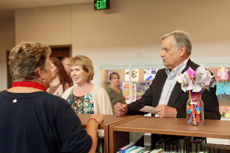 Plainfield Town Council President, Robin Brandgard, with his wife Jenny, learn more about the Discovery Center during the Guilford Elementary ribbon-cutting event