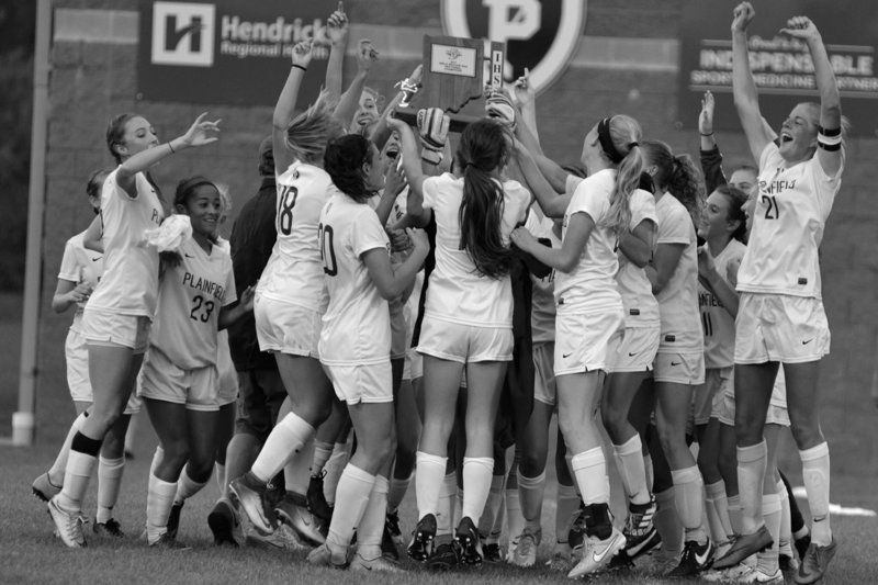 PHS Girls' soccer team jumping for joy with their first sectional trophy