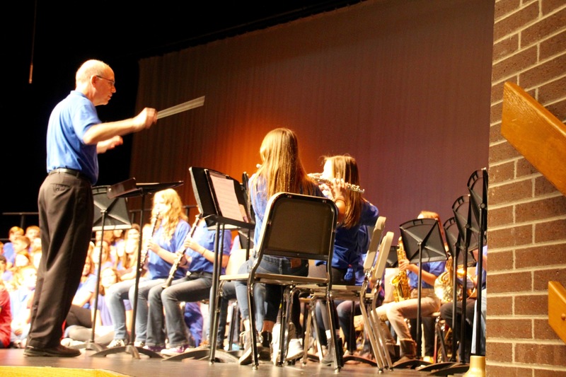 PCMS Band Director Mr. Cummings leads his 7th grade students in the National Anthem