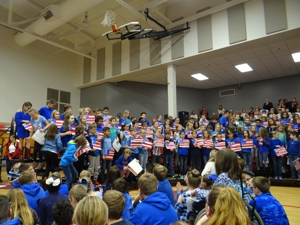 Central students use their hand-colored flags to illustrate their performance.