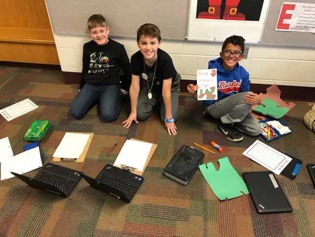 These 4th grade boys did some research before illustrating their Veterans Day cards.