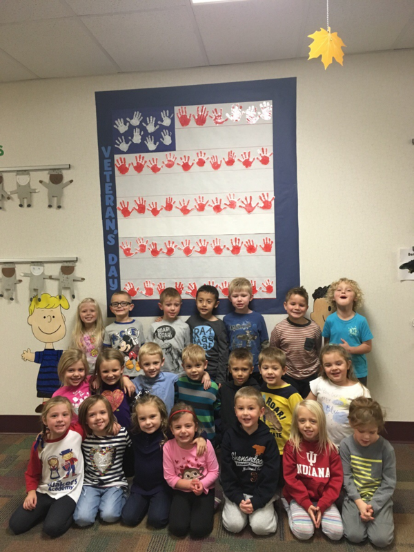 Using their handprints to create their own flag, these pre-schoolers say "thank you, Veterans!"