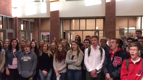 Belles et Beaux students sang the National Anthem for students and staff as part of the school's Veterans Day honors.