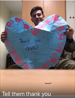 PHS grad, Gabe Burkhardt, is currently stationed in the Middle East, and is thanking LQA students for the care package and handprint heart they sent him earlier this month.