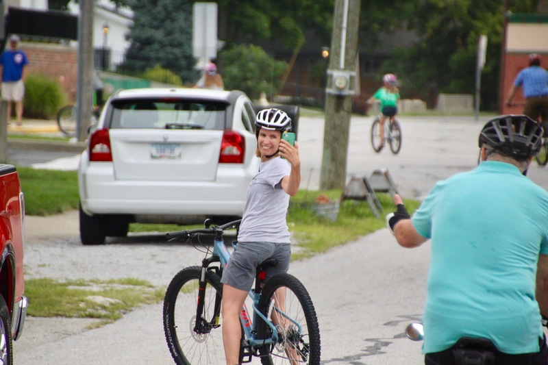 Daniel Gibbs' wife, taking photos of the group as they approached the Central parking lot