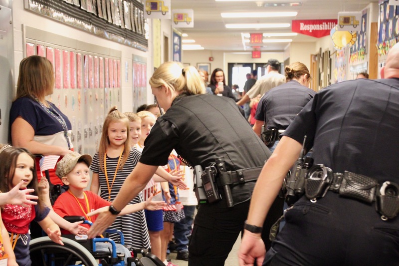 On Patriot Day, veterans and first responders visit Plainfield's elementary schools to participate in the "High Five for Heroes" parade.