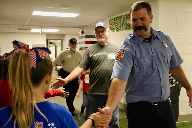 On Patriot Day, veterans and first responders visit Plainfield's elementary schools to participate in the "High Five for Heroes" parade.