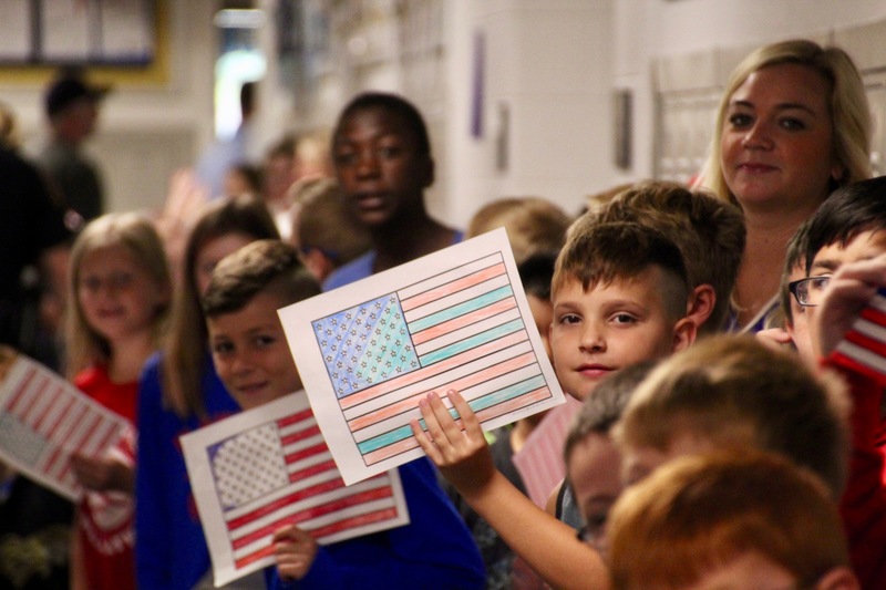 On Patriot Day, veterans and first responders visit Plainfield's elementary schools to participate in the "High Five for Heroes" parade.