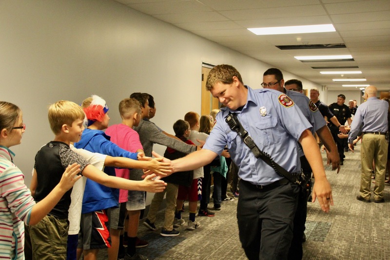 On Patriot Day, veterans and first responders visit Plainfield's elementary schools to participate in the "High Five for Heroes" parade.