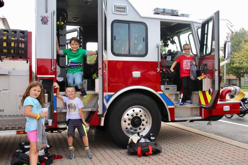 Climbing aboard a fire truck is always a big hit