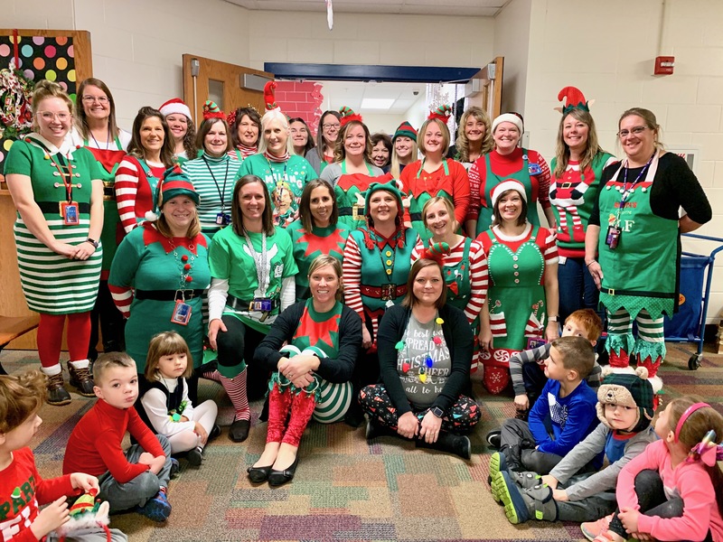 The staff at Little Quakers Academy, all dressed as the jolliest of elves!